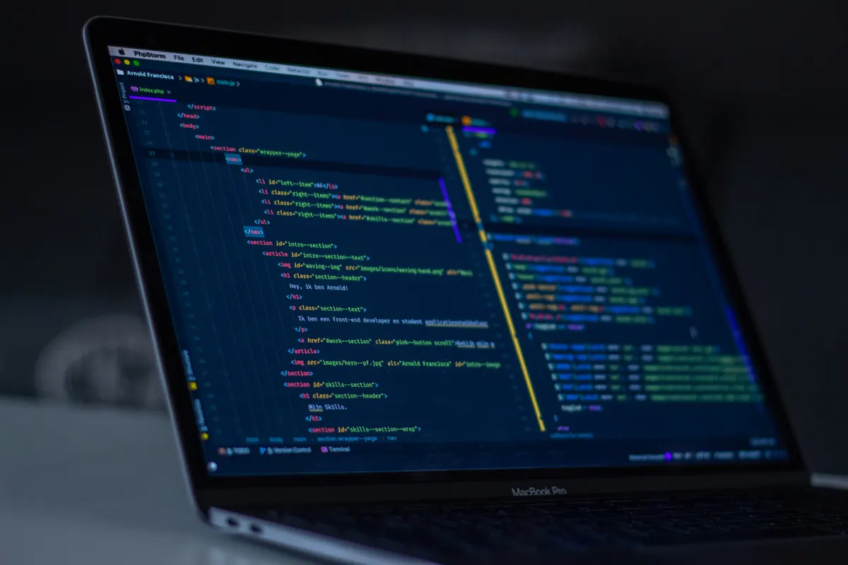 Modern developer workspace with laptop and coding setup for AI-assisted development