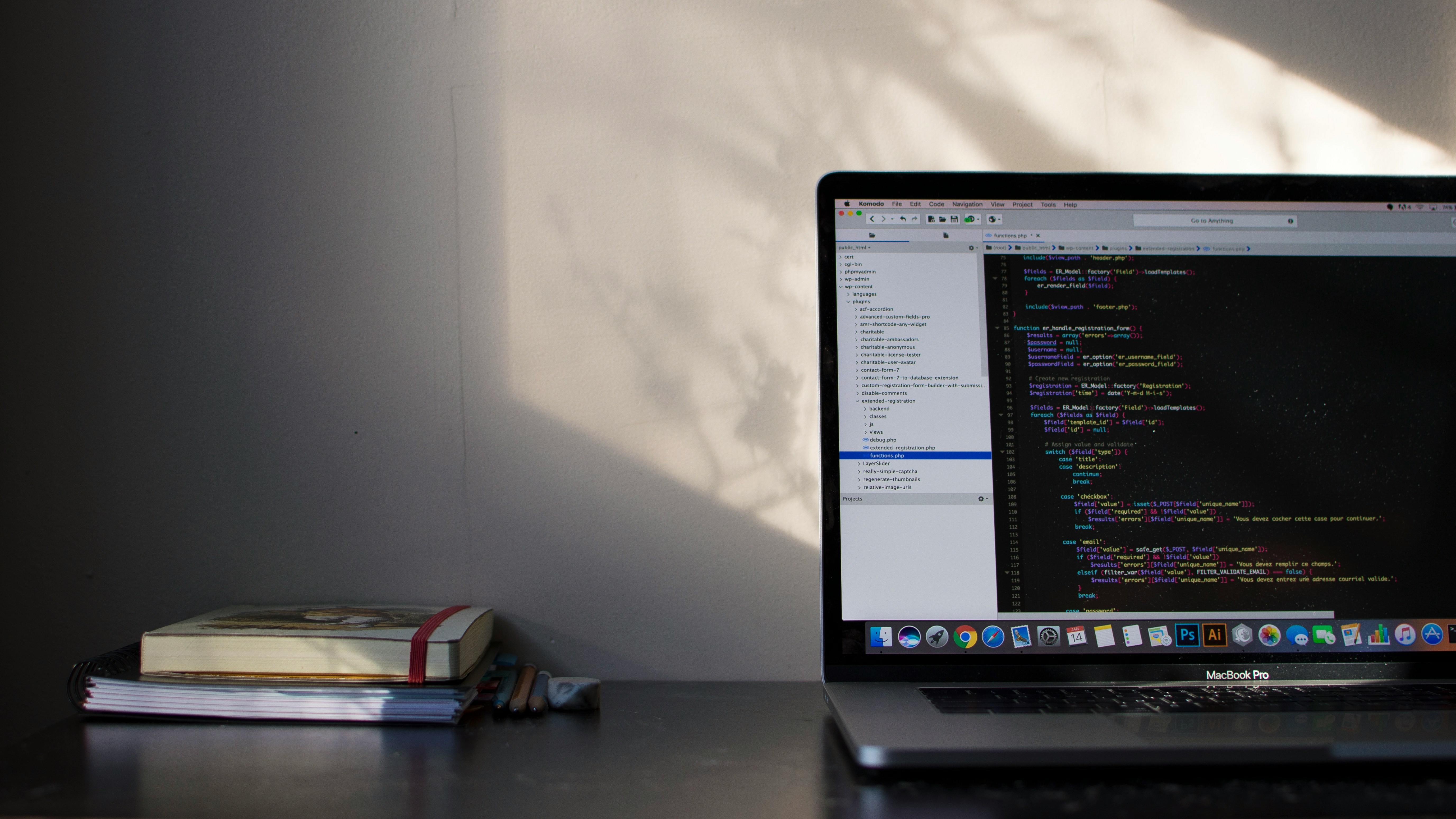 MacBook Pro showing programming code and web development environment for JavaScript testing