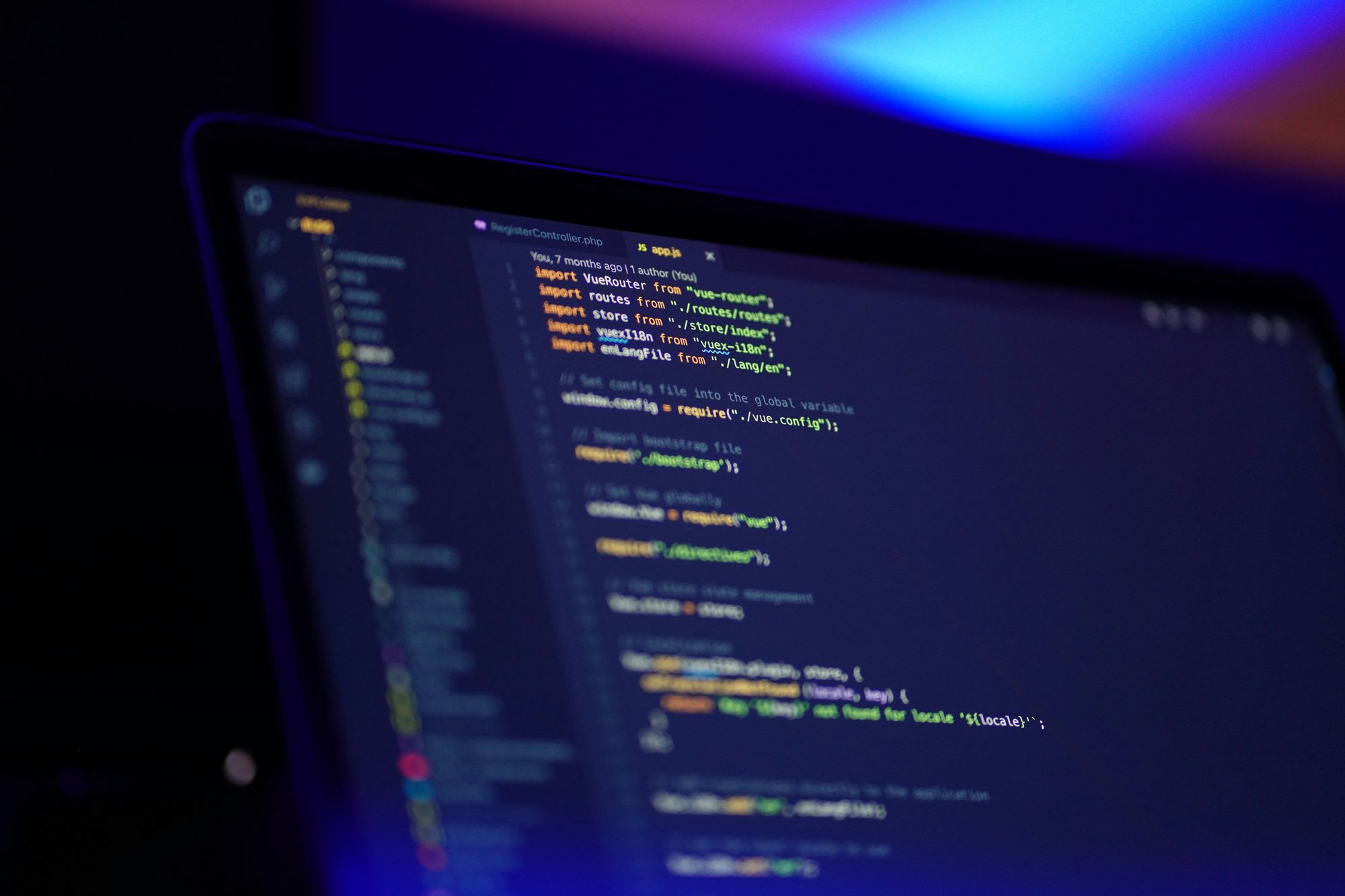 Laptop displaying code with database dashboard